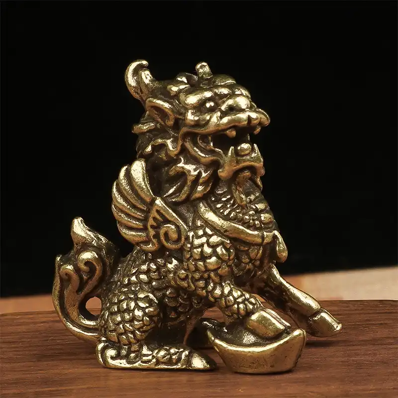 Close-up view of bronze Qilin figurine head featuring dragon-like features and mythical creature details.
