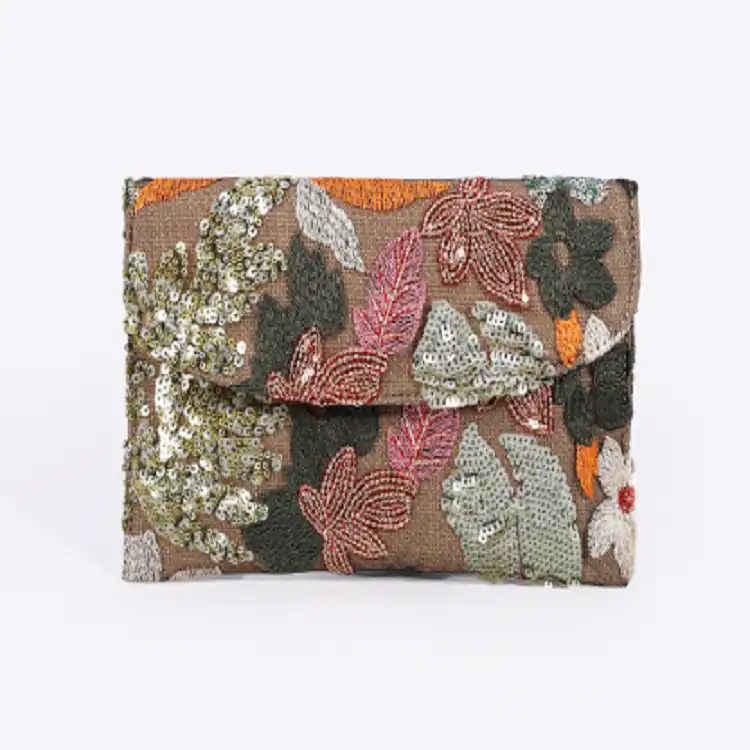 Floral pattern embroidery detail highlighting cotton linen blend and craftsmanship.