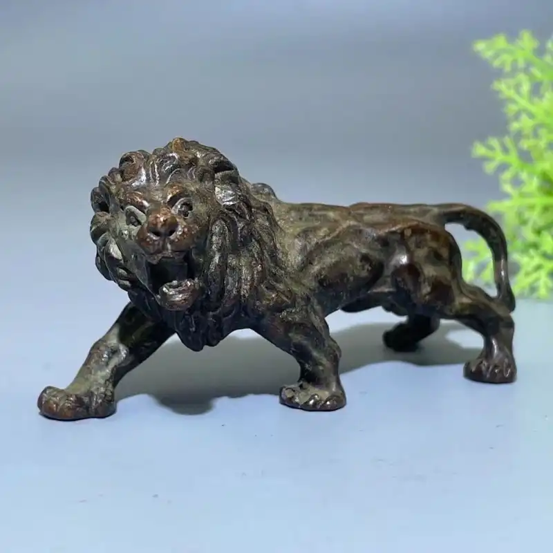 Antique bronze lion miniature statue tea pet made from premium metal for tea ceremony use.