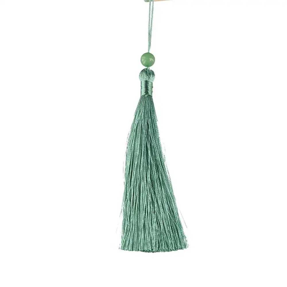 Lifestyle photography of round bamboo fan integrated into daily summer activities.
