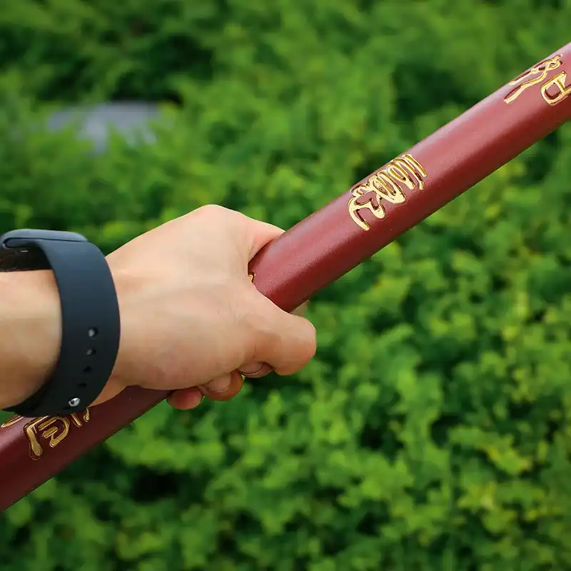 Black Myth Wukong cudgel handle details showing 60cm grip length and ergonomic design features.