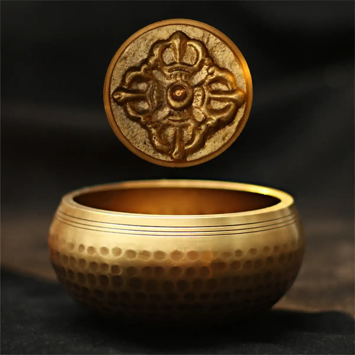Handmade Tibetan copper singing bowl with golden finish crafted by Nepal artisans for meditation.