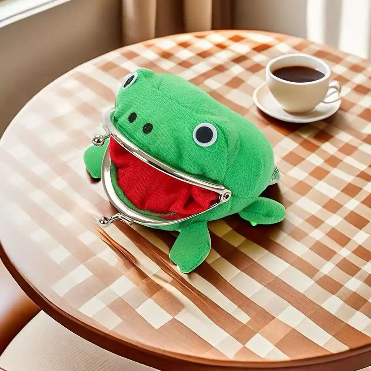 Cute cartoon frog coin purse keychain on white background..