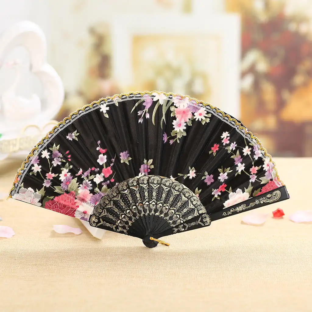 Japanese hand fan photographed in wedding setting as elegant bridal accessory option.