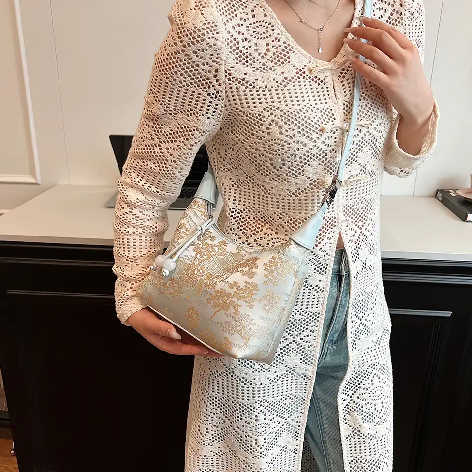 Designer handbag lifestyle shot with elegant fashion accessories.