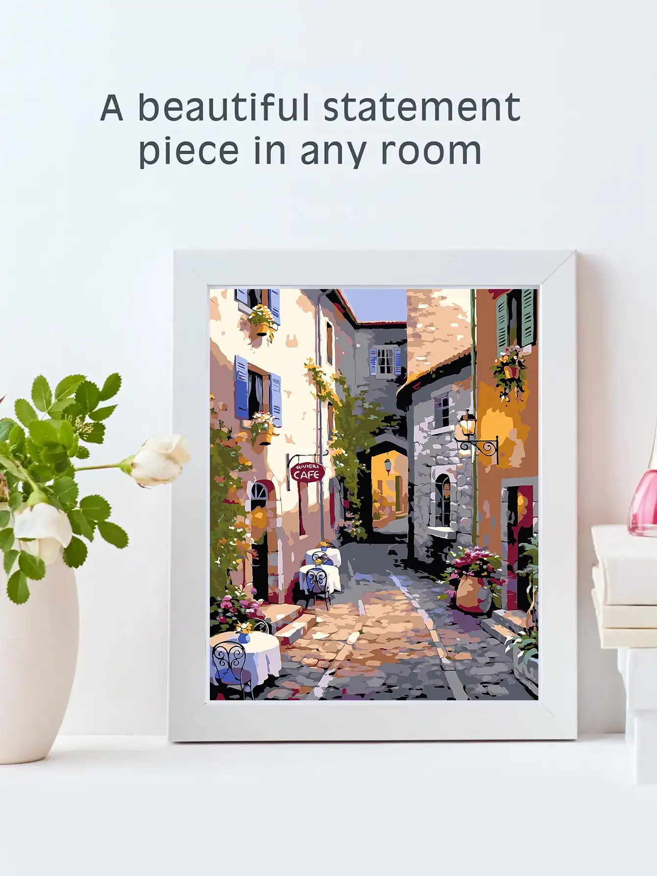 Family activity scene with multiple people working on landscape painting together using the kit.