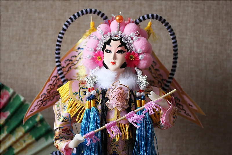 Resin hands positioning demonstration on traditional Beijing Opera silk figurine.