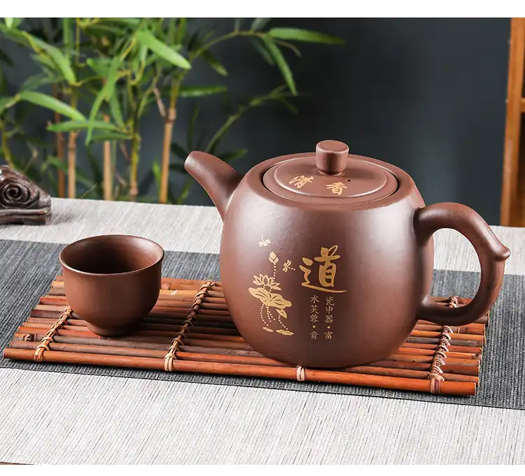 Authentic Yixing purple clay teapot showing detailed craftsmanship and elegant traditional curves.