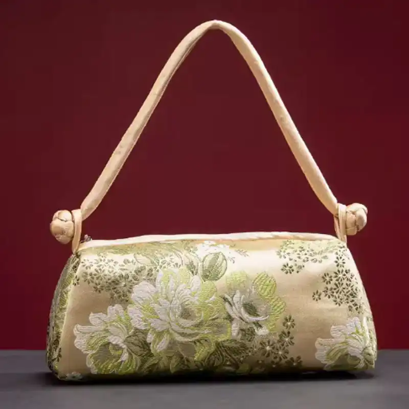 Zipper closure detail on luxury silk embroidered evening bag ensuring secure item protection.