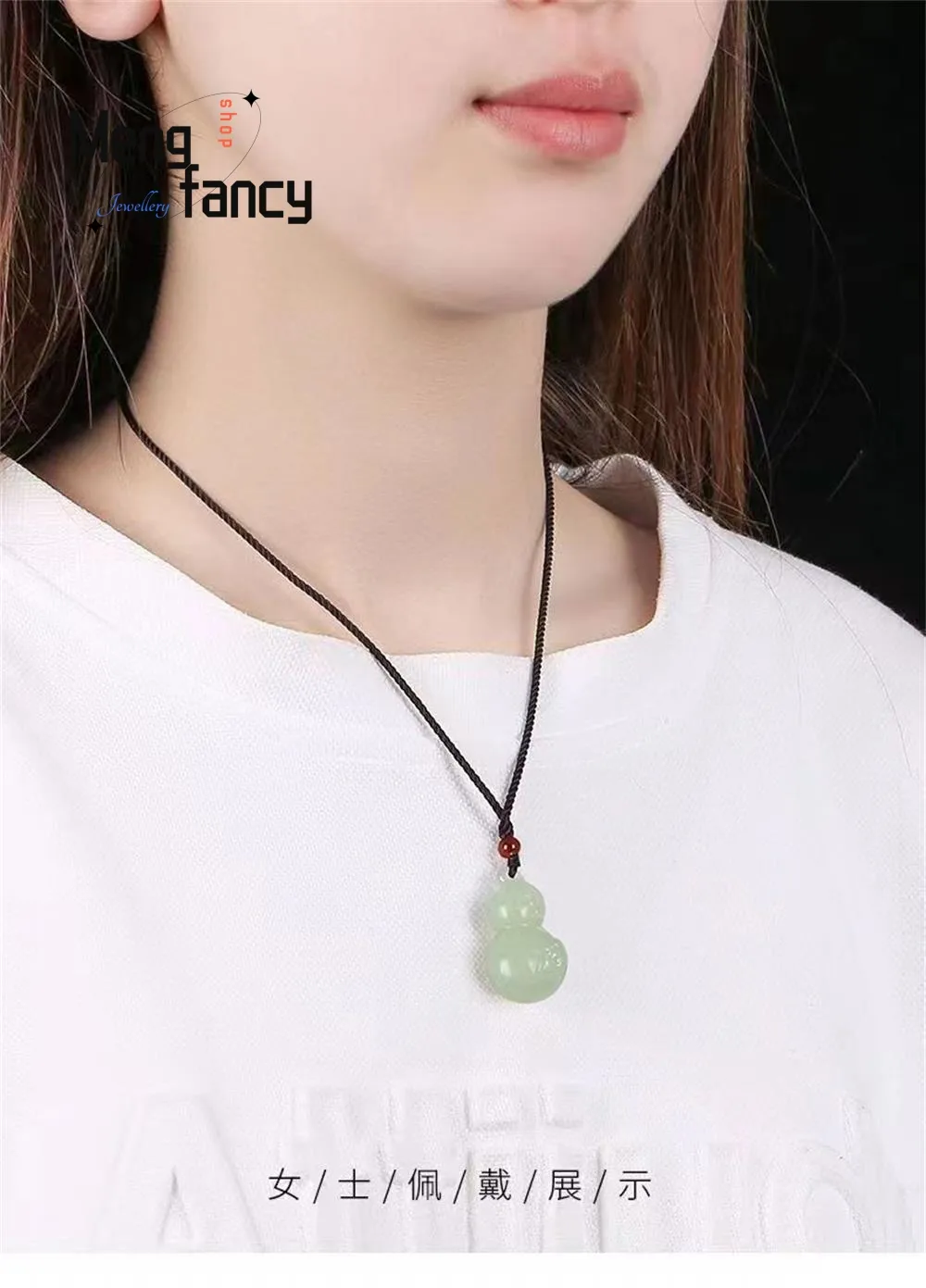 Jade gourd pendant in jewelry box presentation showing gift packaging and premium quality appearance.
