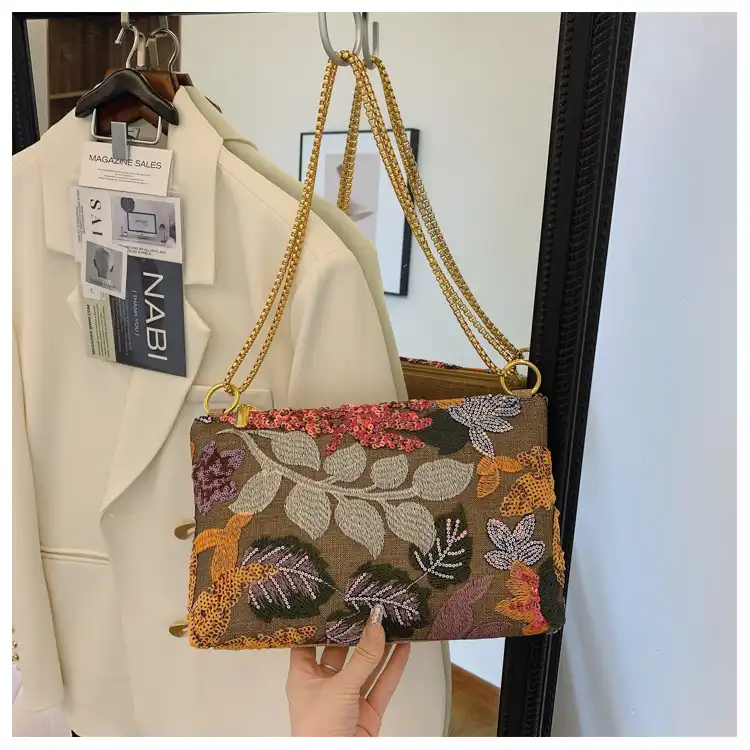 Square shaped embroidery bag displaying compact dimensions perfect for carrying daily essentials.