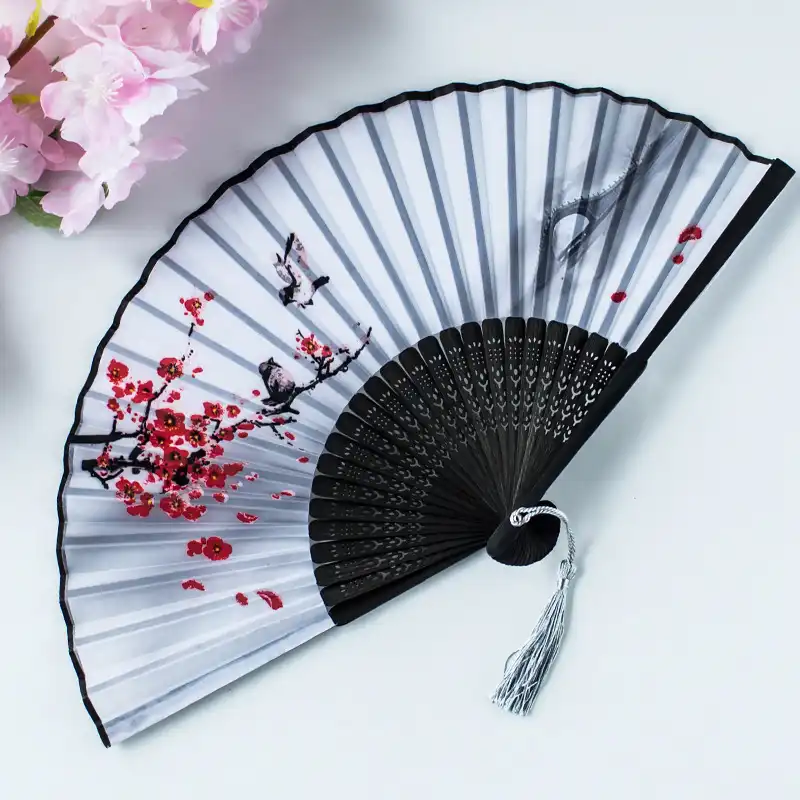 Christmas celebration with folding fans used as unique holiday decoration pieces.