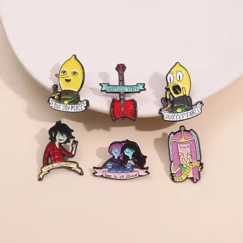 Cartoon monk enamel pin displayed on black backpack..