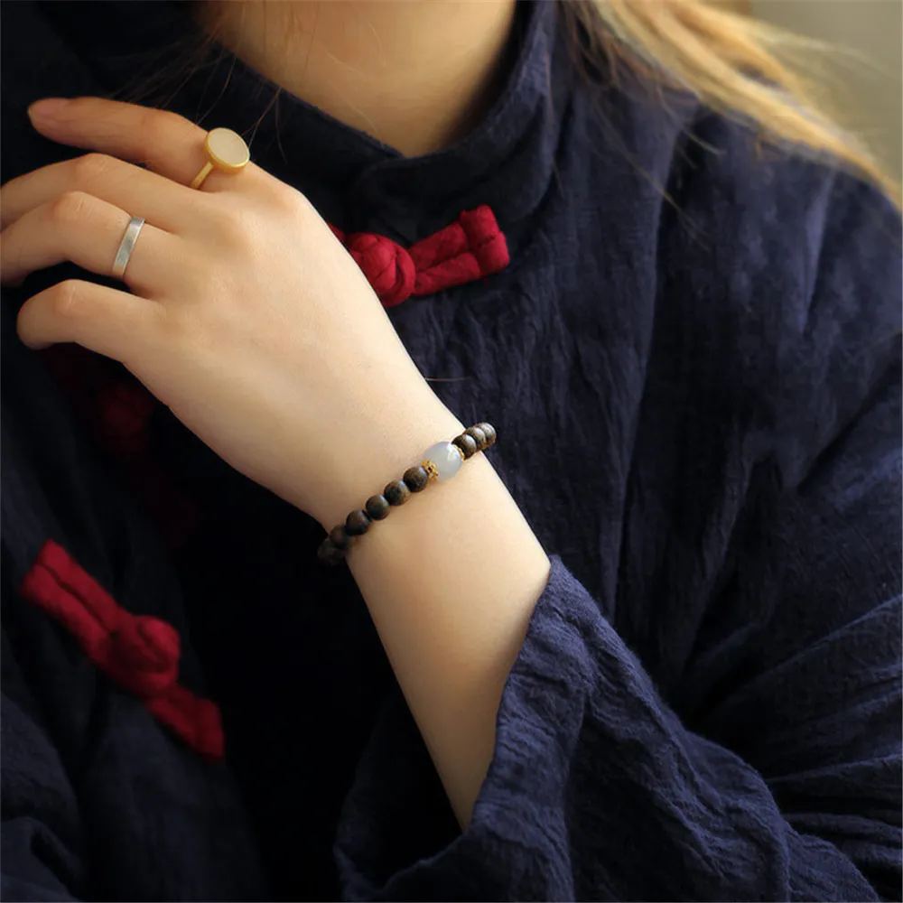 Buddha bracelet worn on wrist showing comfortable fit and elegant spiritual jewelry styling.