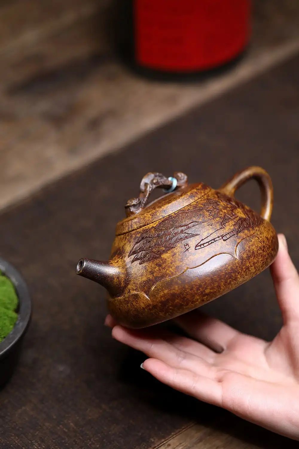 Authentic Yixing purple clay showing natural keel gold sand texture and firewood firing color variations.