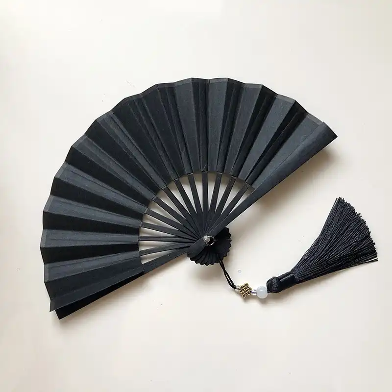 Educational classroom setting using paper fans for Japanese culture learning and art activities.