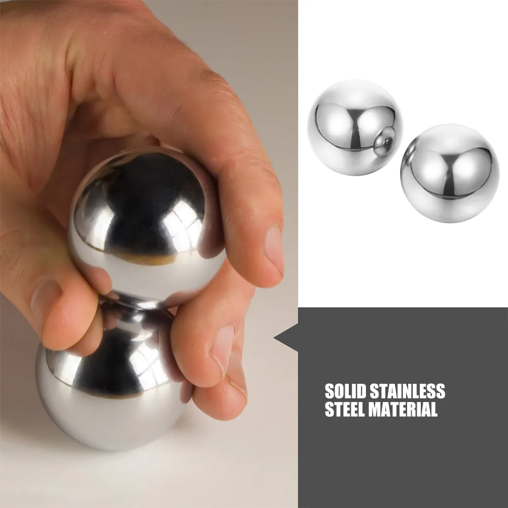 Size comparison showing 52mm diameter Baoding balls perfect for adult hand exercise.