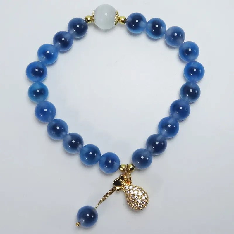 Close-up view of geometric droplet shape blue agate beads showing natural crystal texture.