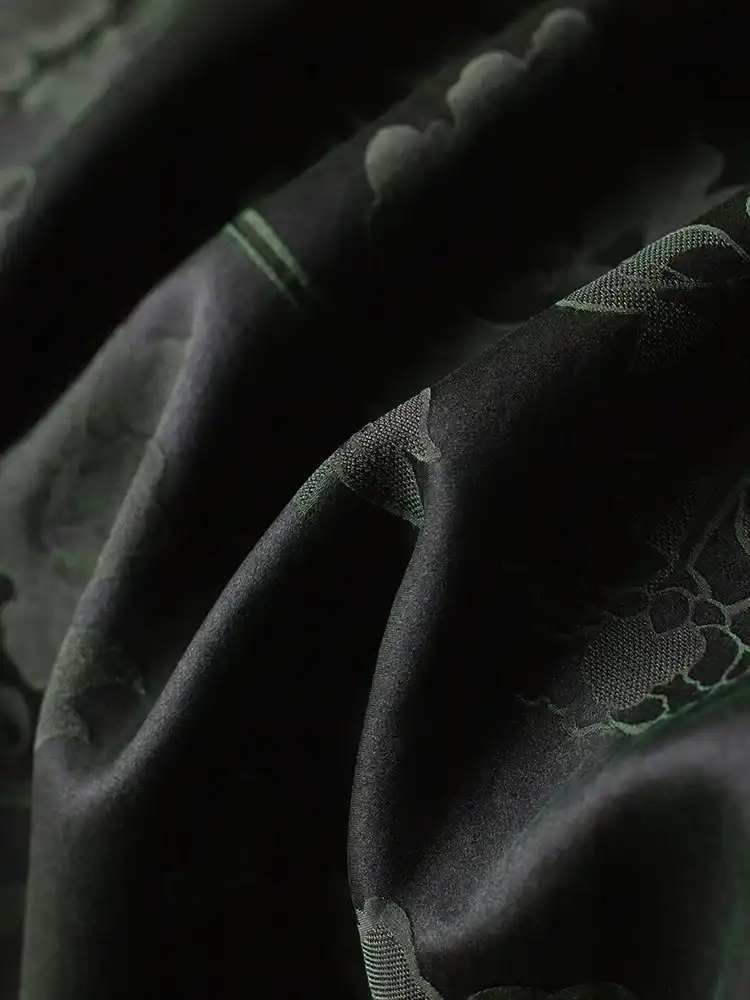 Flat lay of traditional Chinese style cheongsam dress highlighting classic design elements.