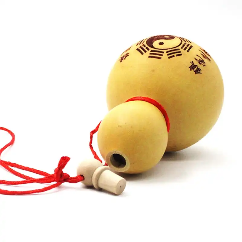 Natural gourd wine container with lid showing traditional Chinese craftsmanship and carving art.