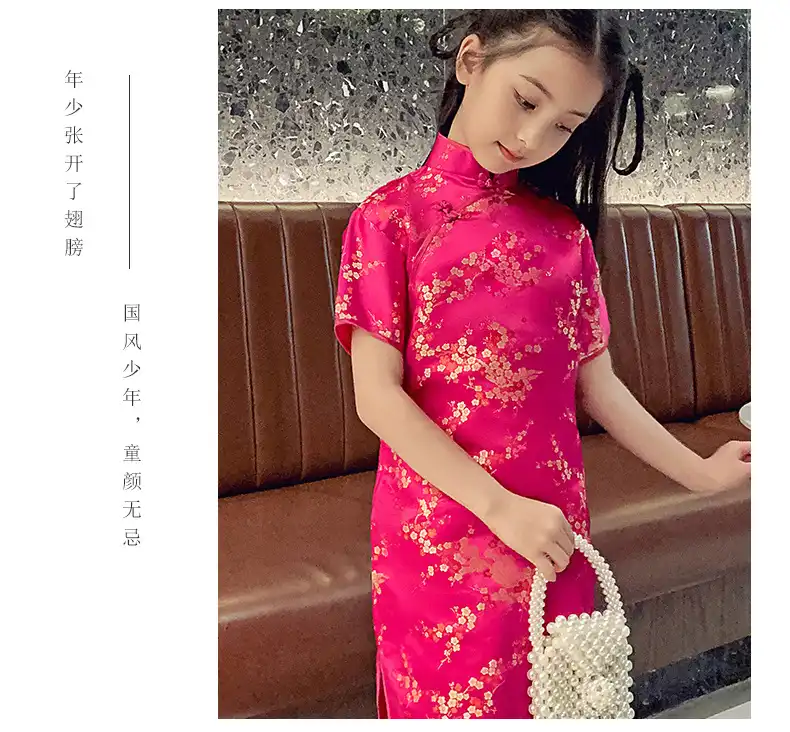 Young girl twirling in summer Chinese princess dress showing graceful movement.