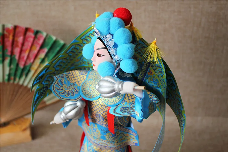 Artificial silk wig with hand-styled hair and gold thread accessories on opera doll.