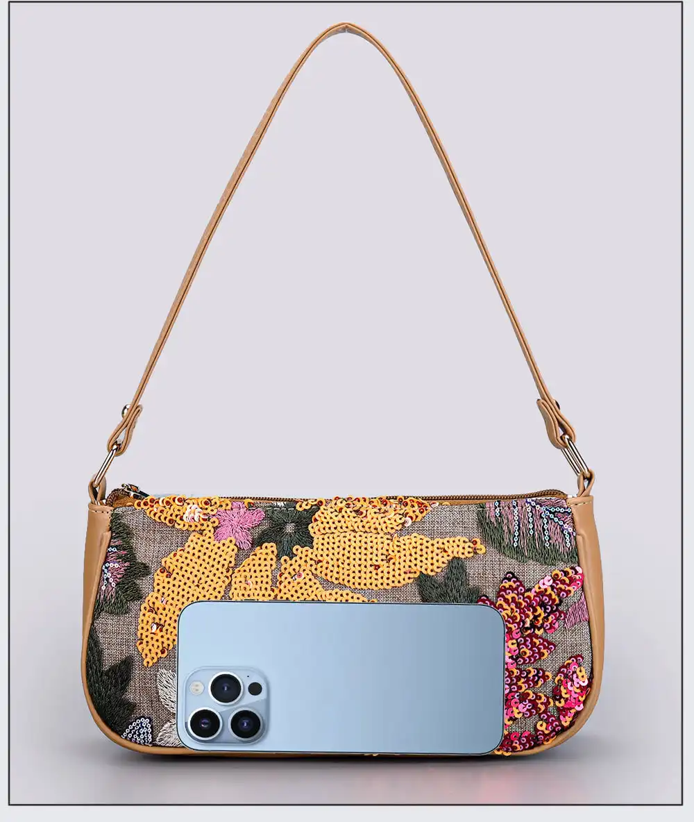Baguette shape shoulder bag showing elegant silhouette and soft construction design.