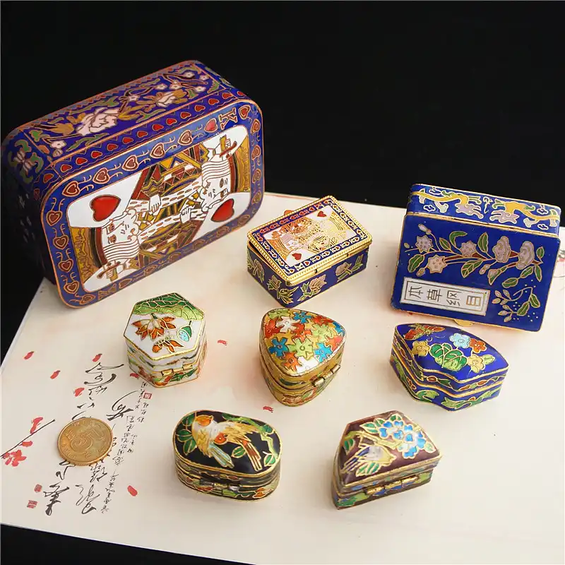 Open cloisonne box revealing interior craftsmanship and demonstrating functional lid mechanism.