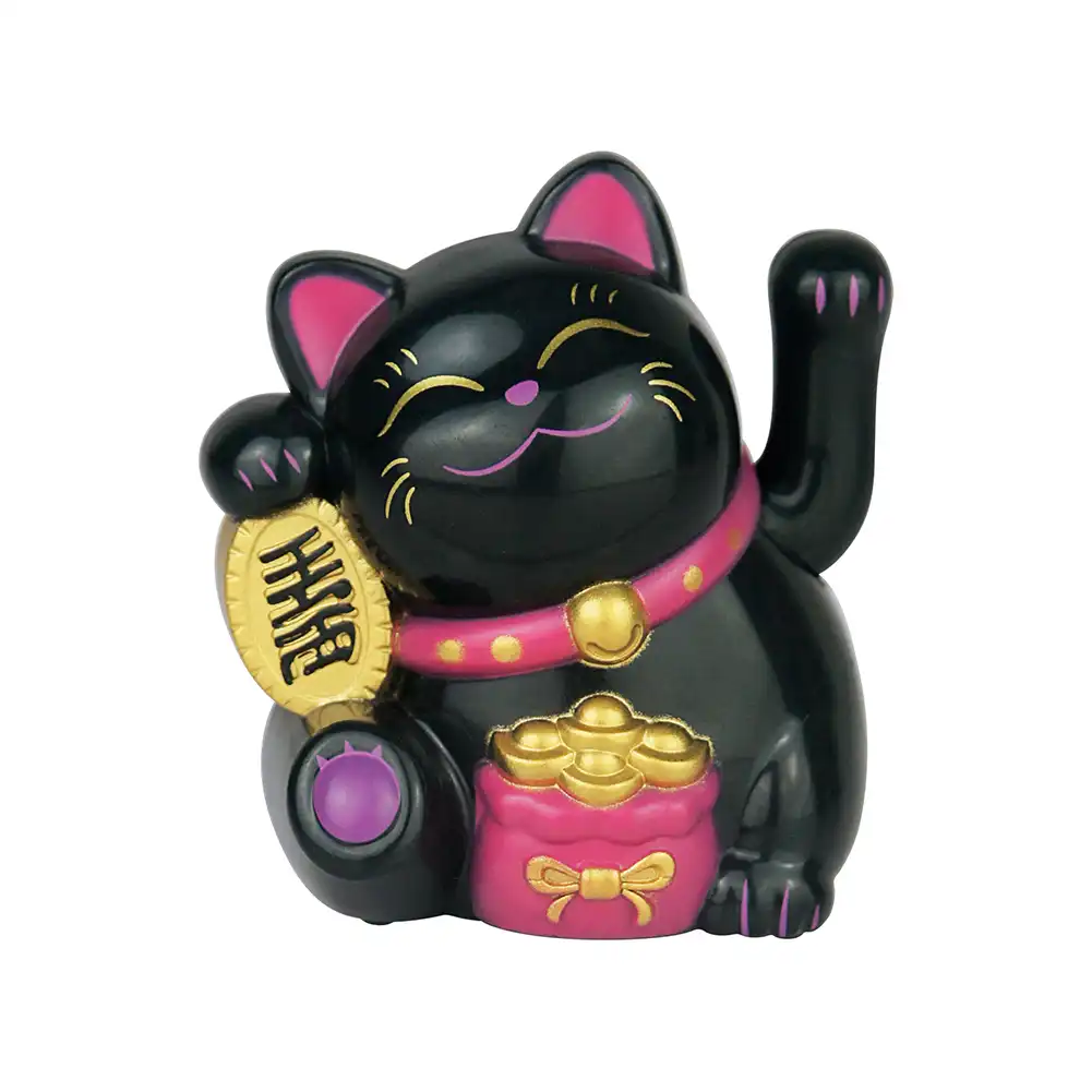 Dashboard ornament installation showing secure placement of solar lucky cat.