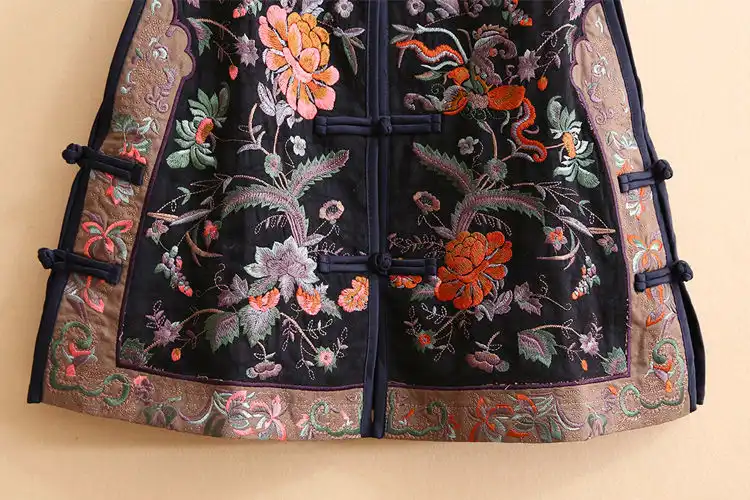 Model wearing elegant embroidered tang suit vest with traditional Chinese floral patterns.