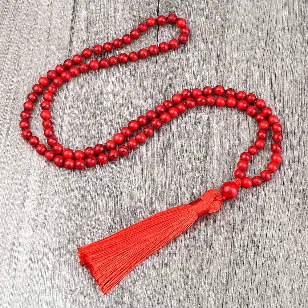 Buddhist mala necklace used during yoga and meditation practice session at home.