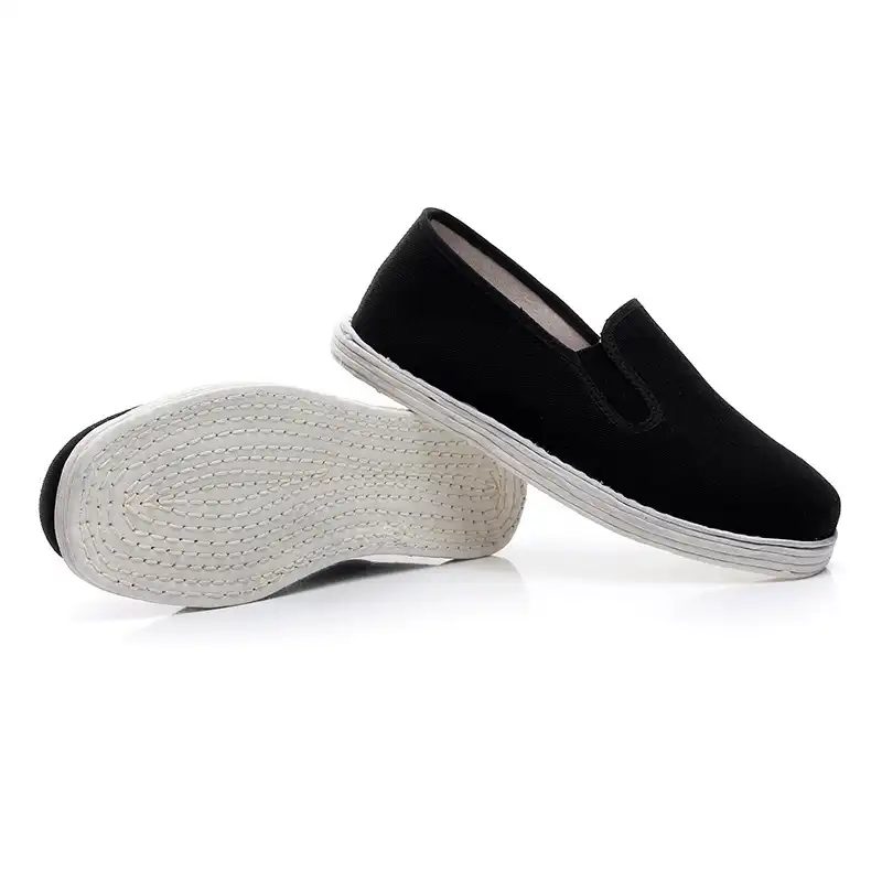Black traditional Chinese kung fu shoes with cotton upper and rubber sole for martial arts training.