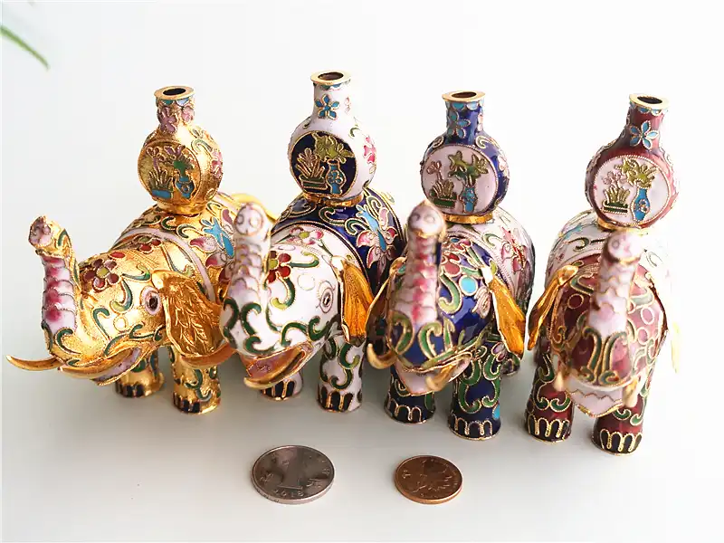 Complete elephant figurine showcasing traditional copper body with colorful enamel glaze.