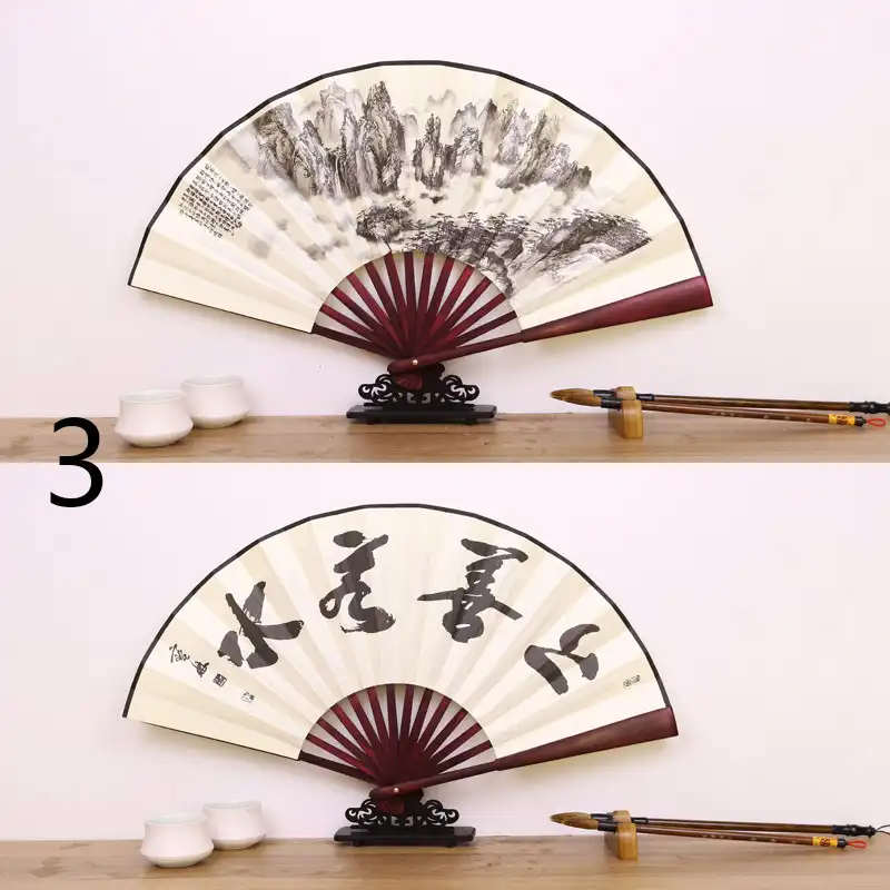 Traditional Chinese setting with silk fan alongside cultural artifacts showing authentic heritage appeal.