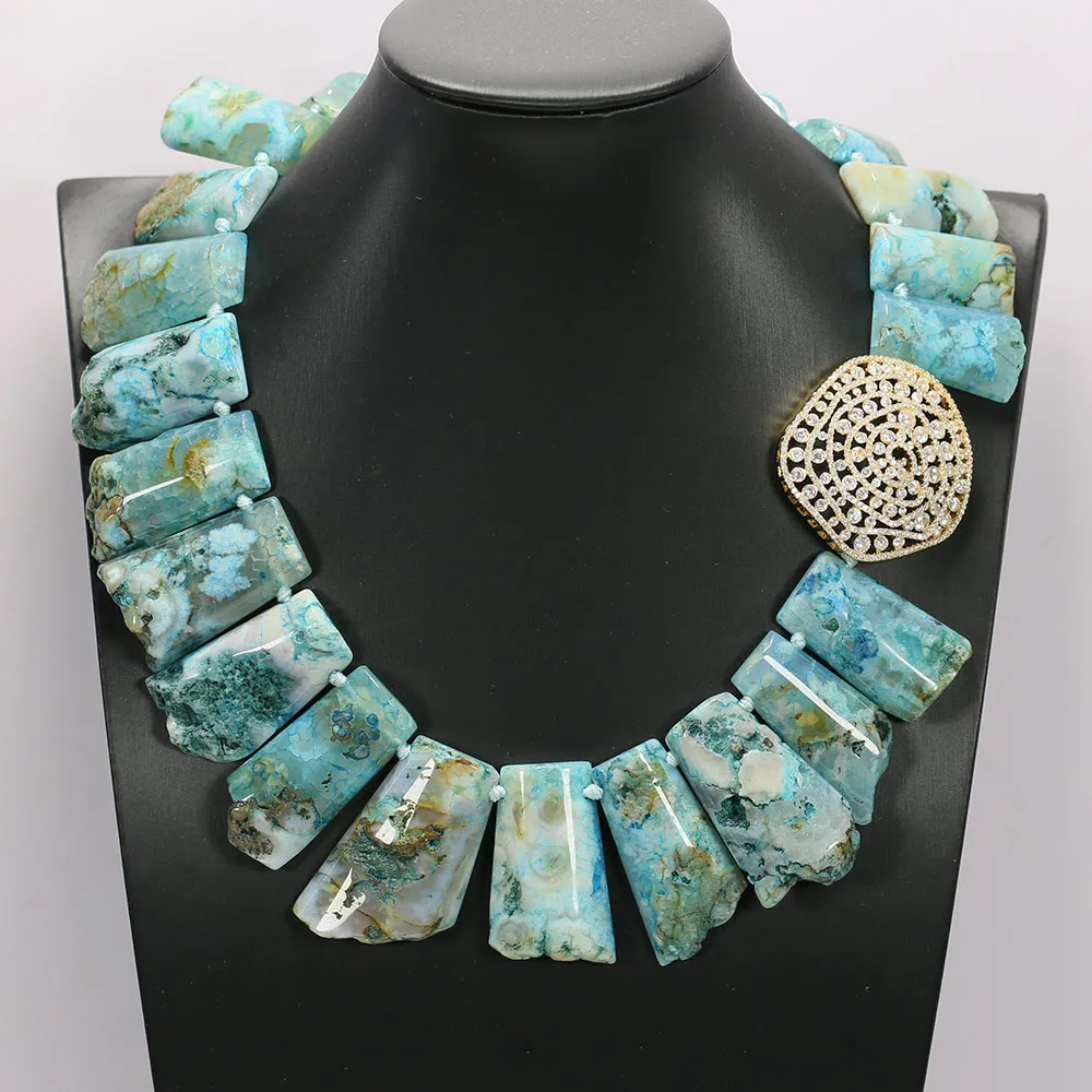 Model wearing blue agate ocean jasper necklace demonstrating 18 inch length and style on person.