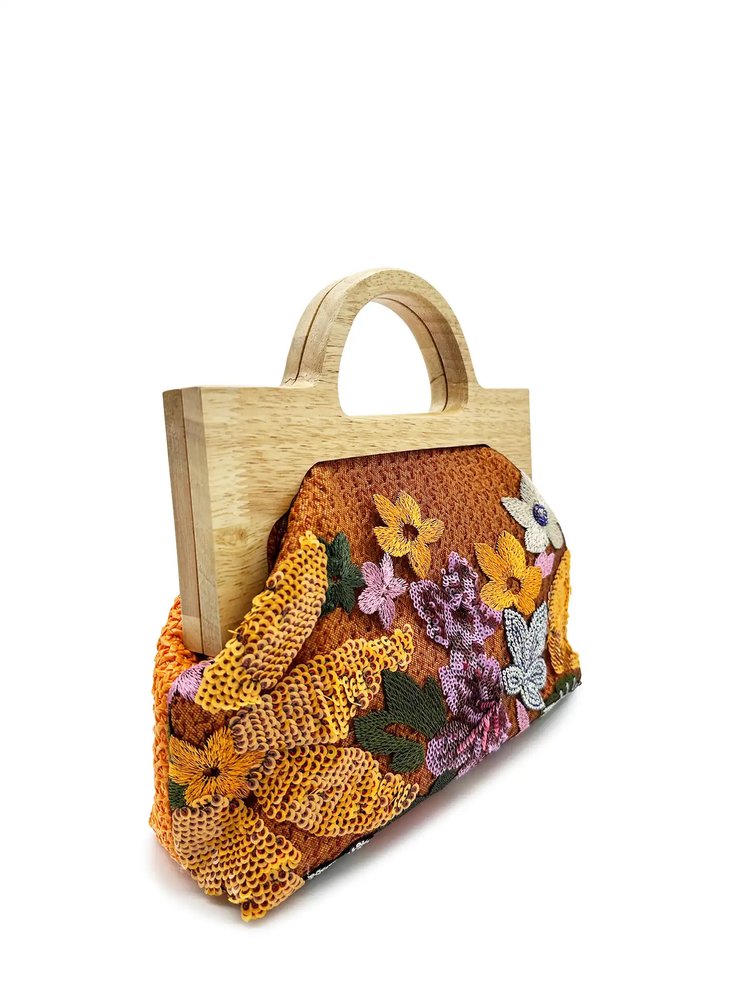 Party setting showcasing glamorous embroidered clutch with wooden handle for evening occasions.