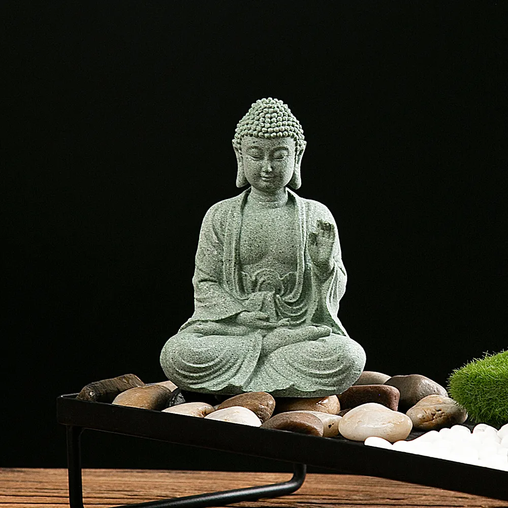 Stone Buddha statue placed in outdoor zen garden showing weather-resistant durability.