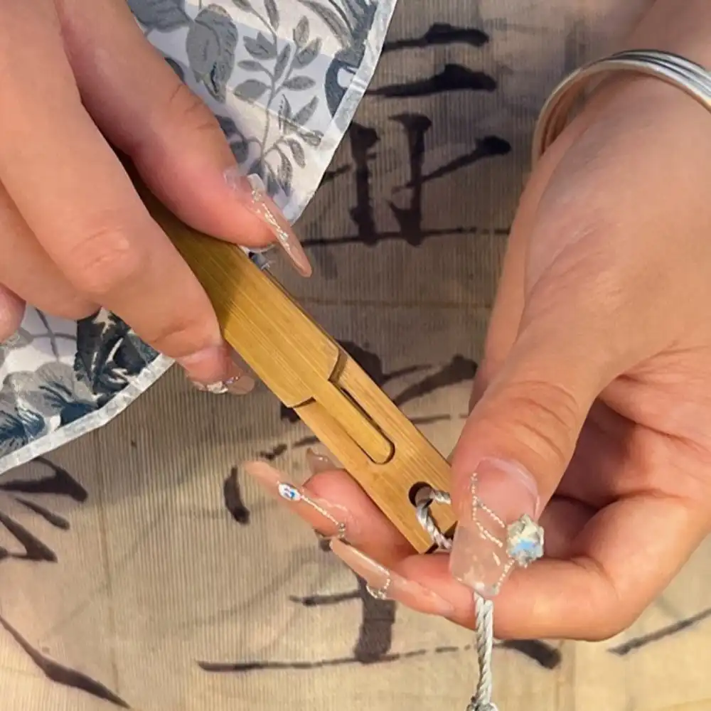 Fan opening sequence showing windmill folding mechanism and gradual circular surface expansion process.