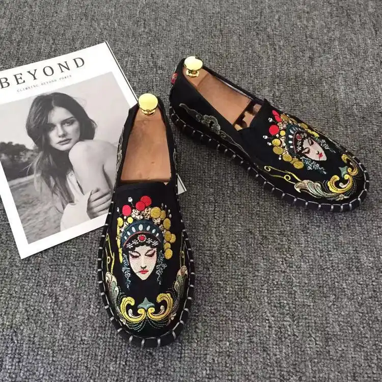 Detail shot of toe area showing intricate flower embroidery work and cotton material quality.