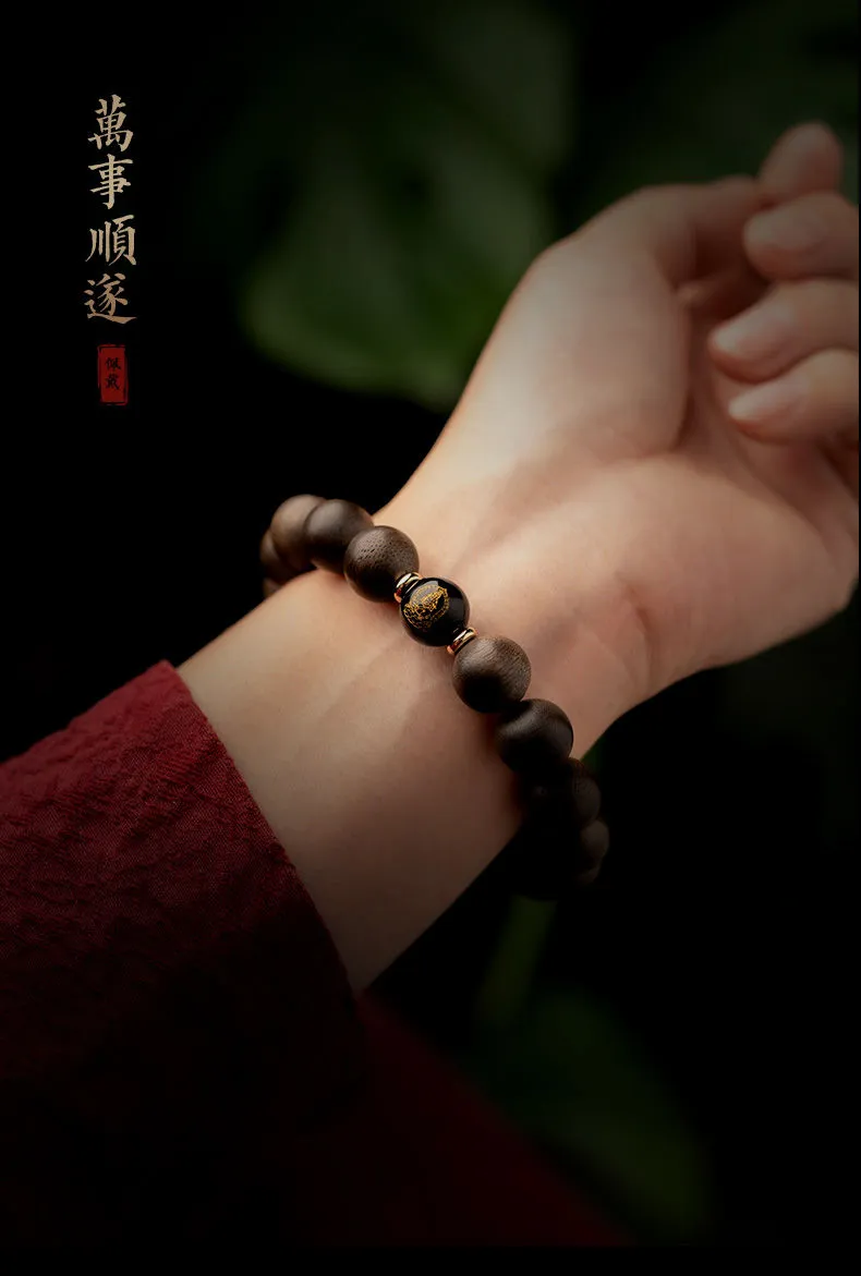 Agarwood Buddha zodiac bracelet on wrist demonstrating proper wearing style for men.