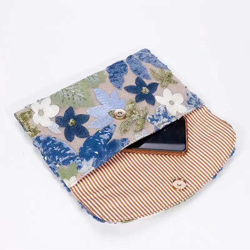 Wedding party styling with embroidery bag paired with formal evening attire.