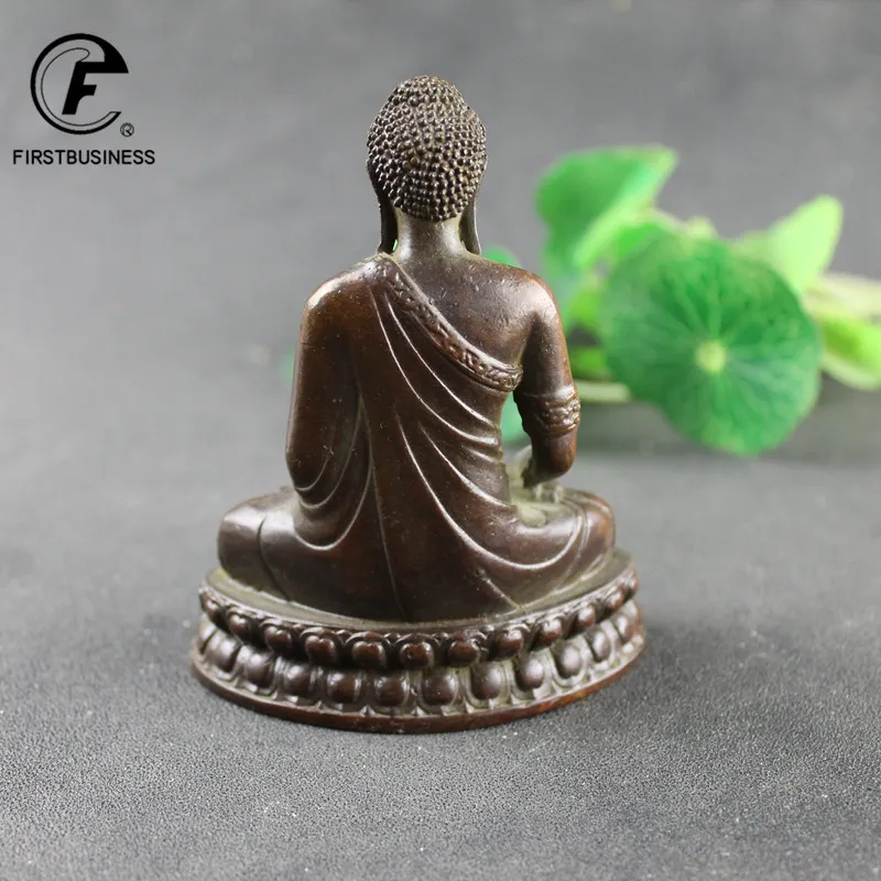 Antique copper Buddha figurine side angle showing detailed craftsmanship and traditional design.