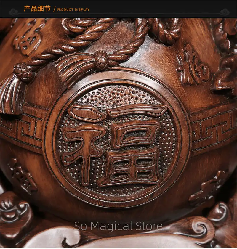 Wu lou displayed with other Chinese feng shui symbols and lucky charm decorations.
