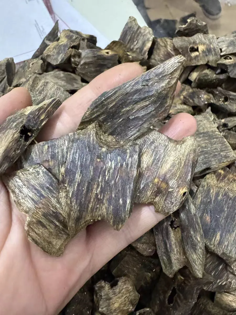 ​​Close-up of authentic oud wood incense chips highlighting premium quality and craftsmanship.