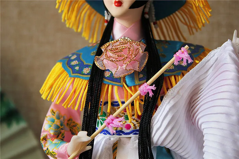 Full body view of 32cm Beijing Opera silk doll standing on wooden square base.