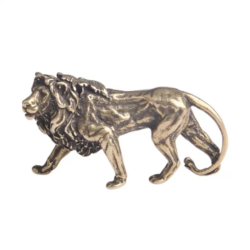 Office desk setup featuring brass lion figurine as professional workspace decoration.