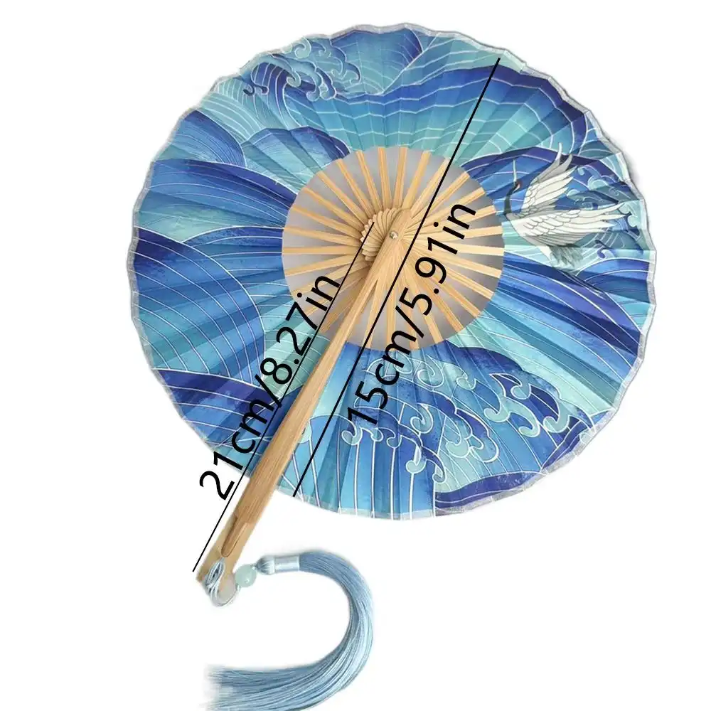 Lifestyle shot of lady using round bamboo fan for summer cooling in elegant setting.