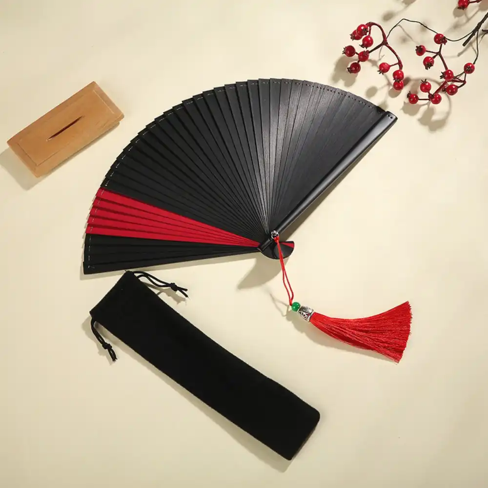 Dance fan with protective cover included for storage and transportation convenience.