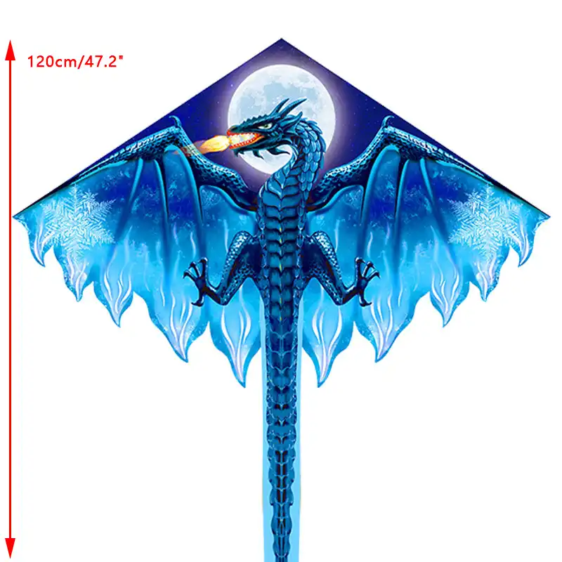 Large dragon kite soaring majestically in blue sky with long flowing tail visible.