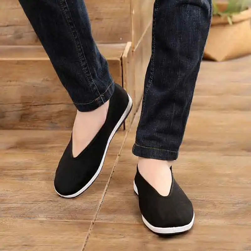 Traditional Chinese cloth shoes displaying flat heel construction for martial arts stability.